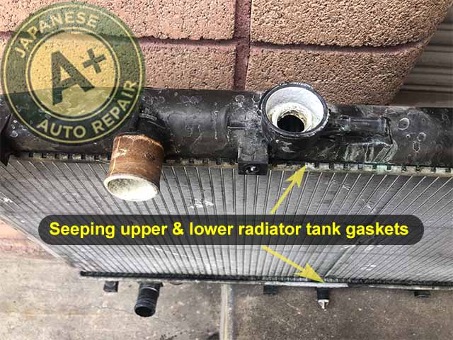 An image showing seeping upper and lower radiator tanks - A+ Japanese Auto Repair Inc.